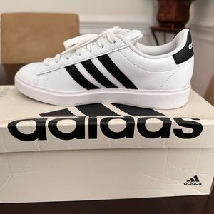 Never worn Adidas sneakers.